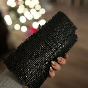 Black Clutch Bag with Shimmering Texture and Rectangular Shape